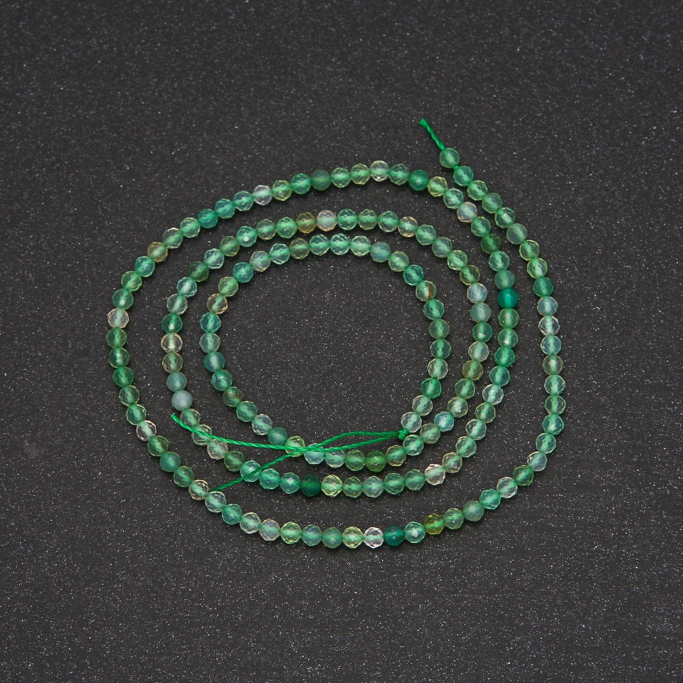 Beads on a thread, nephrite, faceted ball, diameter 2.5 mm (±), length 38 cm