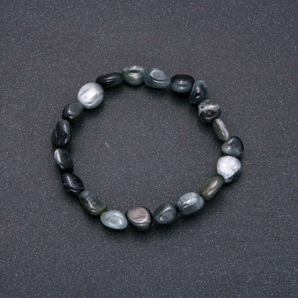 Bracelet made of natural Hawk's Eye stone on elastic cord, faceted, 10x12 mm diameter (±), 18 cm circumference