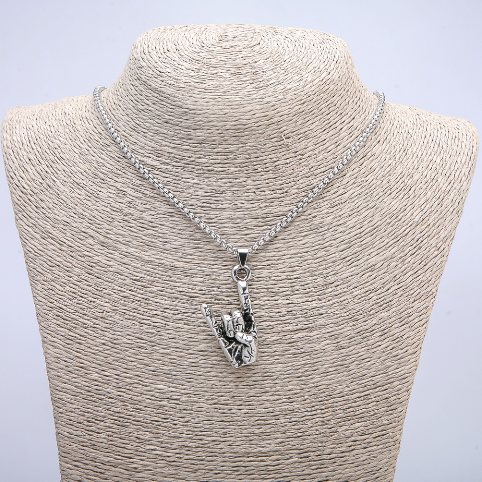 Pendant 'Hand Gesture' 50x20mm on a chain, chain length 70 cm +/- silver-colored metal