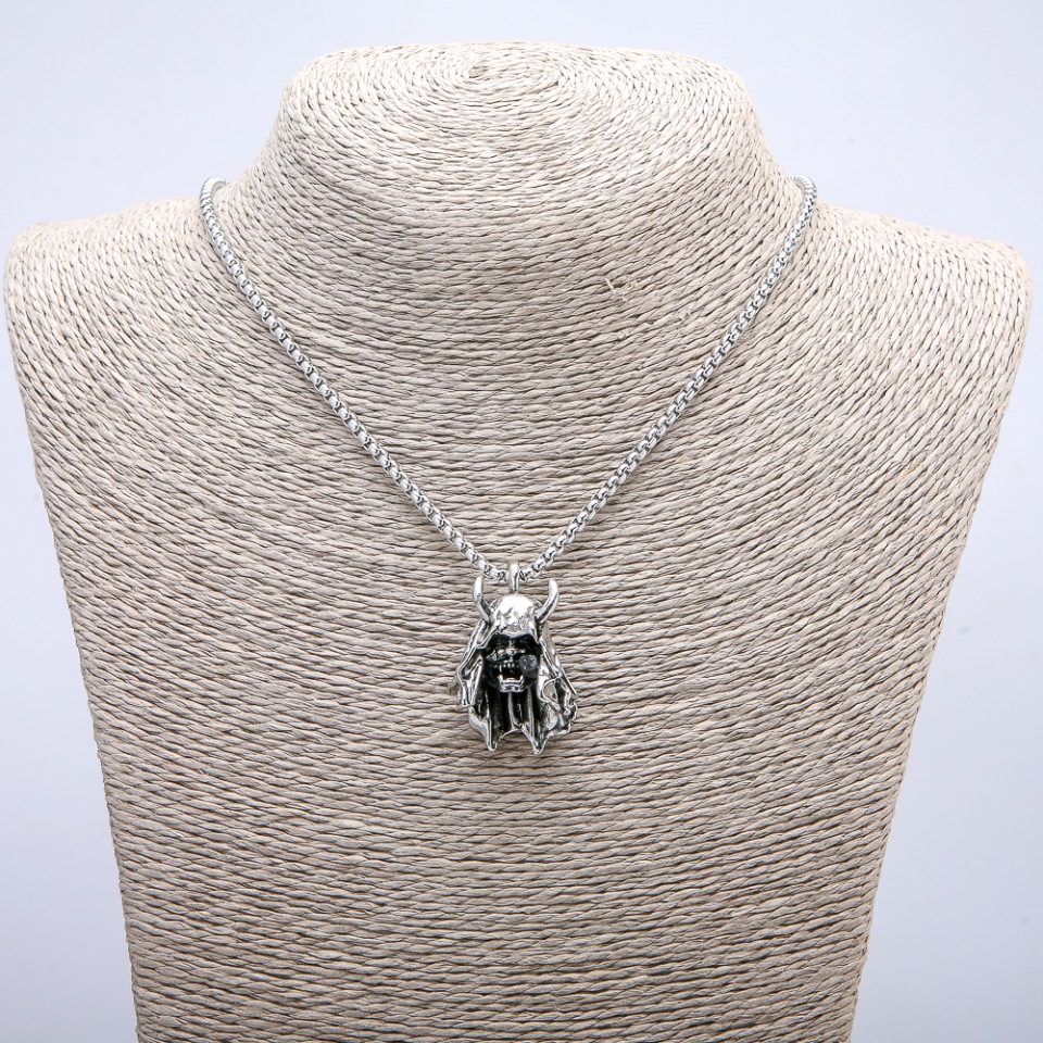 Pendant 'Demon' 35×24 mm on chain, 70 cm long, silver-toned metal