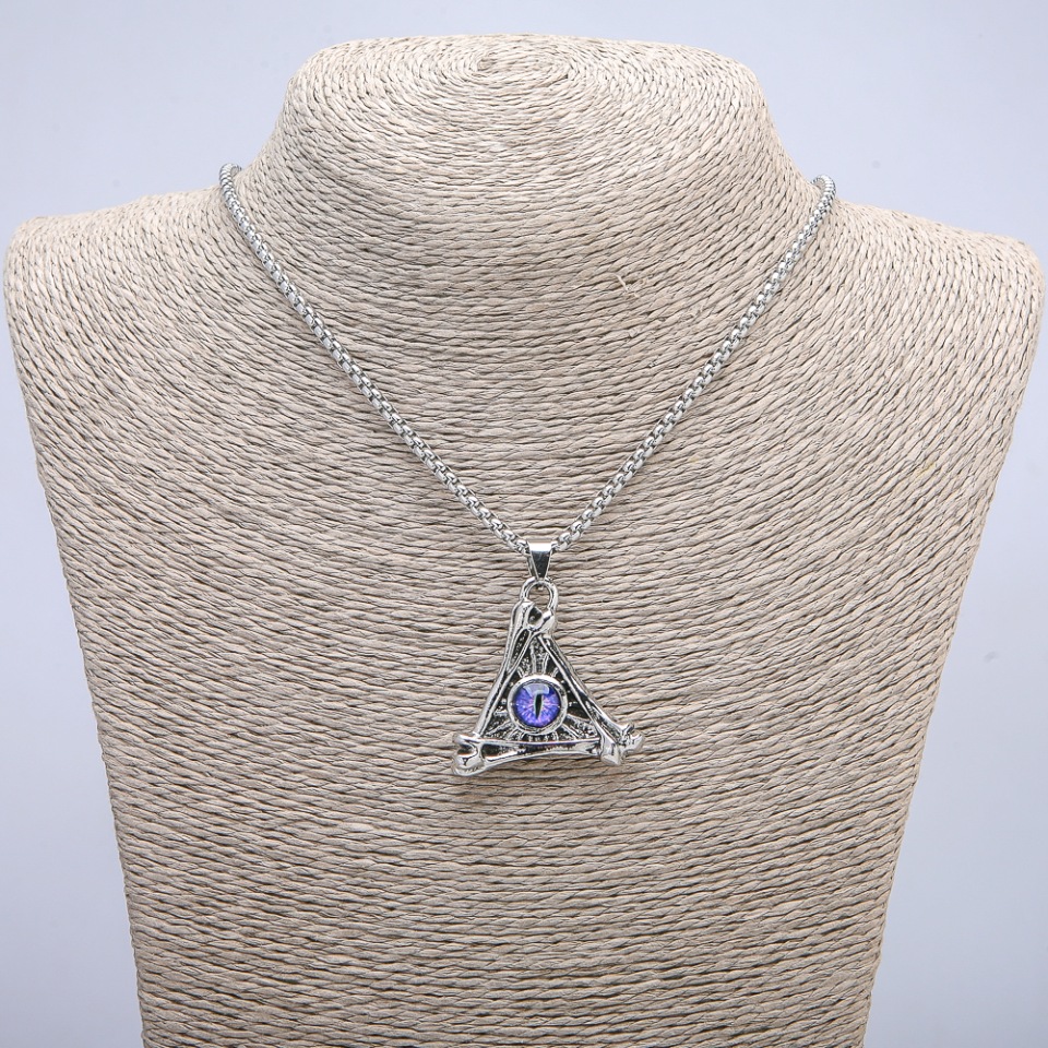 Pendant 'Dragon's Eye in a Triangle' 40x35 mm on a chain, length 70 cm, silver-toned metal