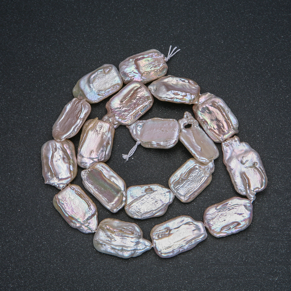 Thread of natural Baroque pearls, diameter 22×14 mm, length 40 cm +/- with petrol luster