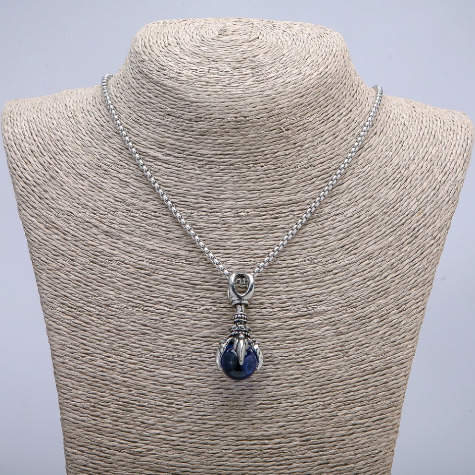 Pendant 'Paw with Sphere' 45x20 mm on a chain, length 70 cm, silver-colored metal