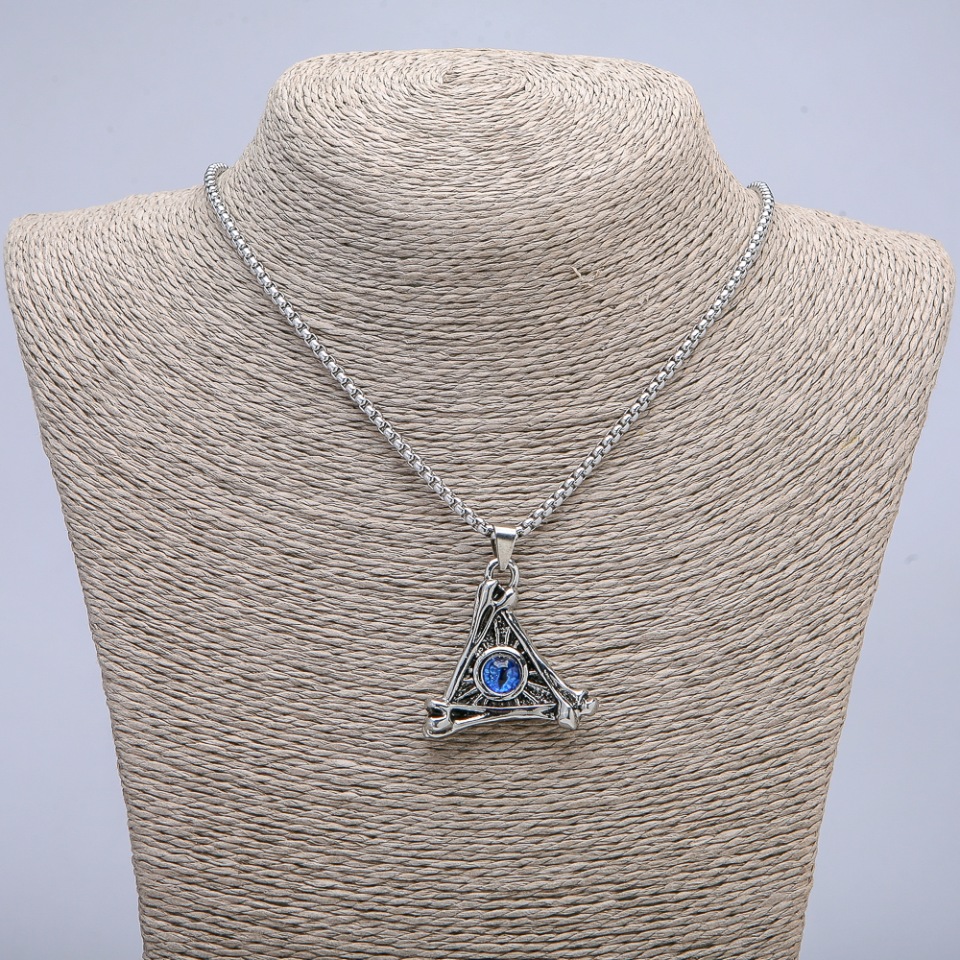 Pendant 'Eye of the Dragon in a Triangle' 40x35mm on a chain, length 70 cm, silver-toned metal
