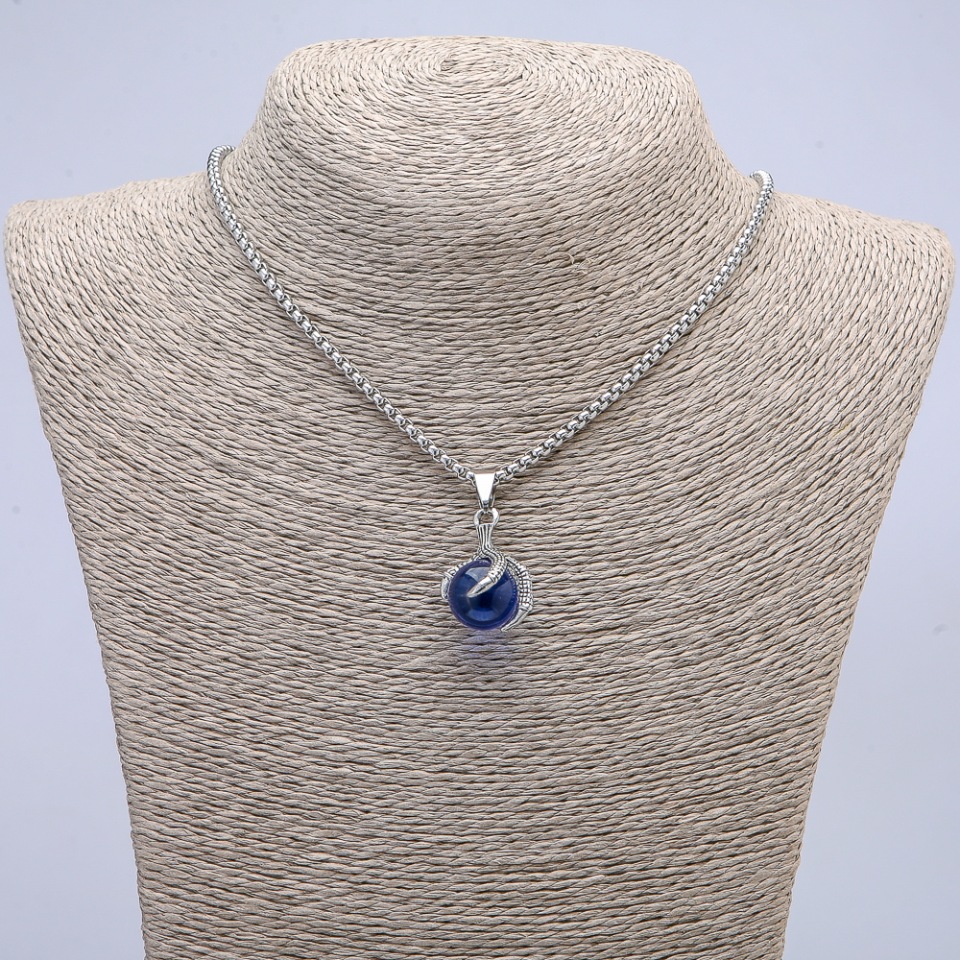Pendant 'Ball in a Paw' 35x17 mm on a chain, length 70 cm +/- silver-colored metal