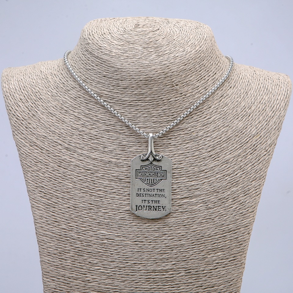 Pendant 57x27 mm on chain, length 70 cm; silver-toned metal