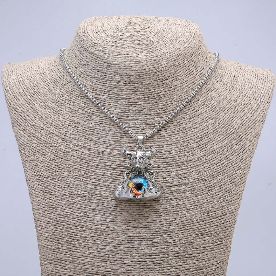 Pendant 'Demon with the Dragon Eye' 45x30 mm on a chain, length 70 cm ± silver-toned metal