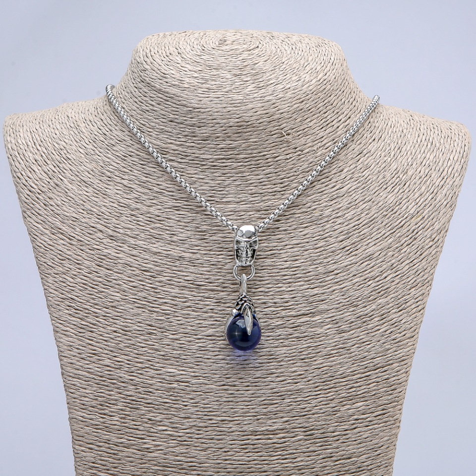 Pendant 'Paw with Ball and Skull' blue 50x16 mm on chain, length 70 cm, silver-colored metal