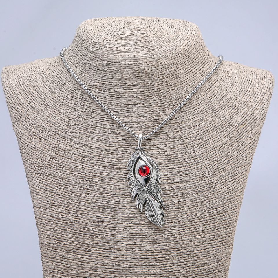 Pendant 'Feather with Dragon Eye' 65x23mm on chain, length 70cm +/- silver-toned metal