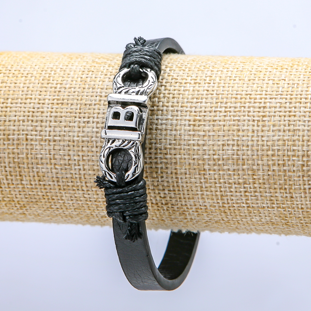 Bracelet with a metal inlay, 21 cm long, 10 mm thick, eco-leather, black