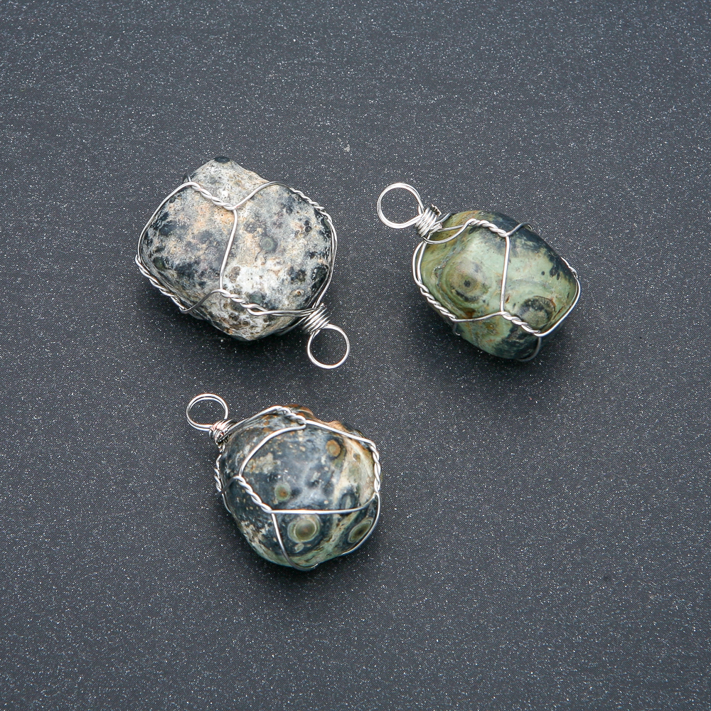Pendant in a silver weave with natural Ocean Jasper, diameter 32×22 mm+
