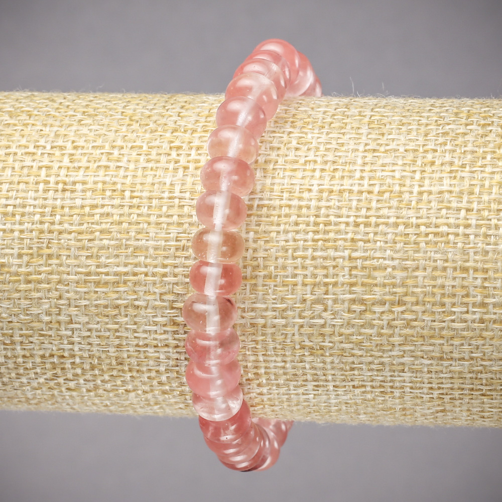Elastic bracelet made of natural chalcedony — smooth rondel beads, diameter 8x5 mm, length 18 cm.