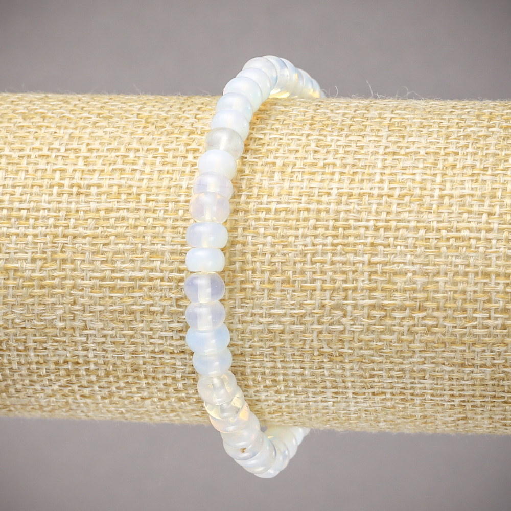 Elastic bracelet with synthetic moonstone, smooth rondelle beads, 6×4 mm diameter, length 18 cm ±