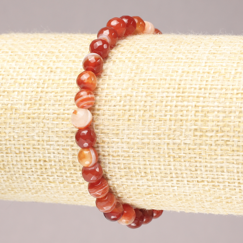 Elastic bracelet with natural orange agate, faceted bead, 6 mm diameter