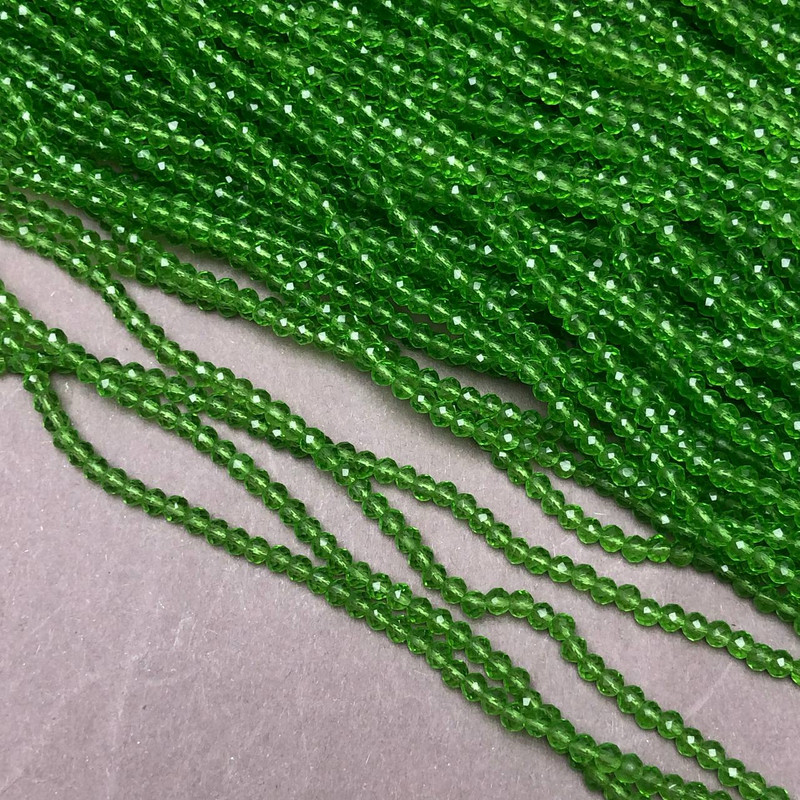 Beads Czech Crystal on beading thread, light-green transparent faceted rondelle, diameter 3×2.5 mm + -, length 36 cm +