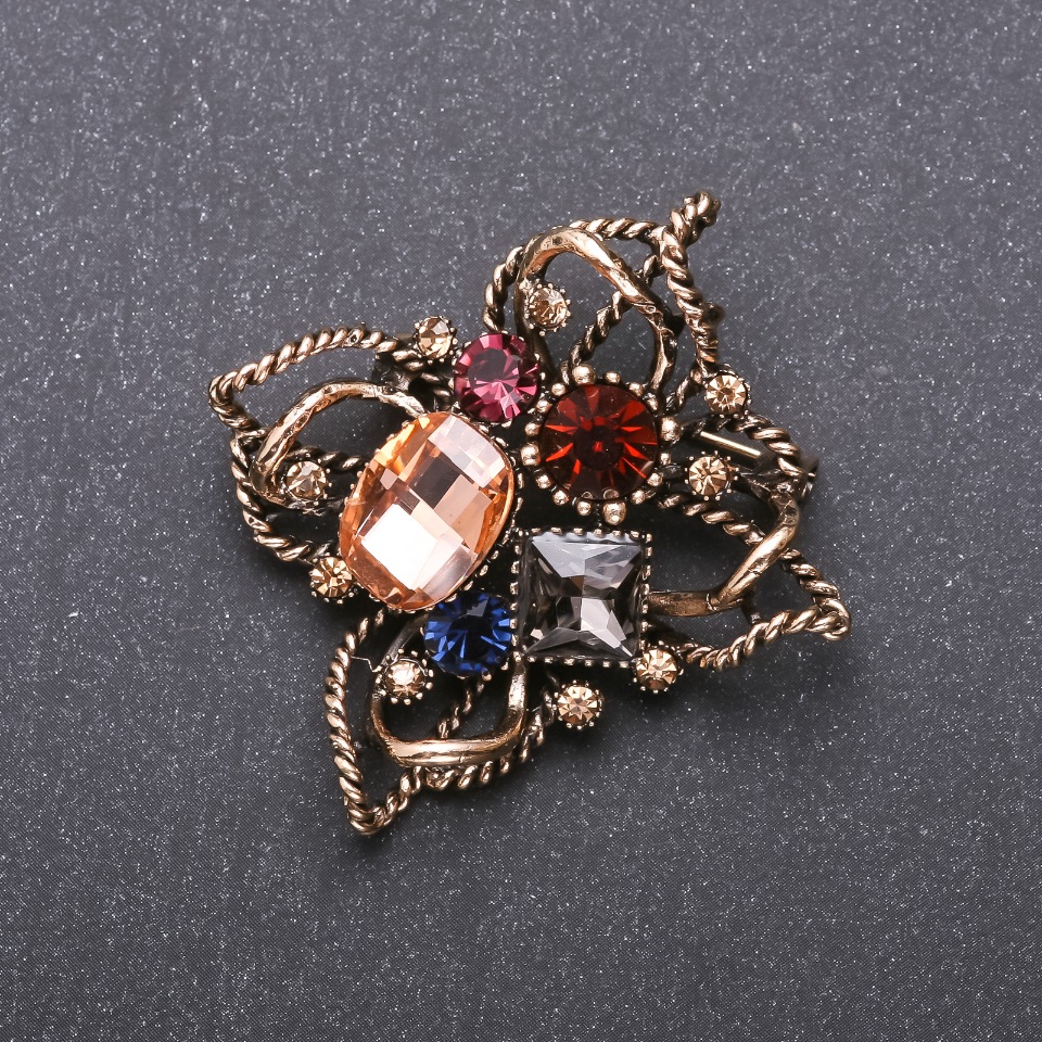 Brooch 'Order of Beauty' with multicolored crystals, 50×48 mm, yellow metal