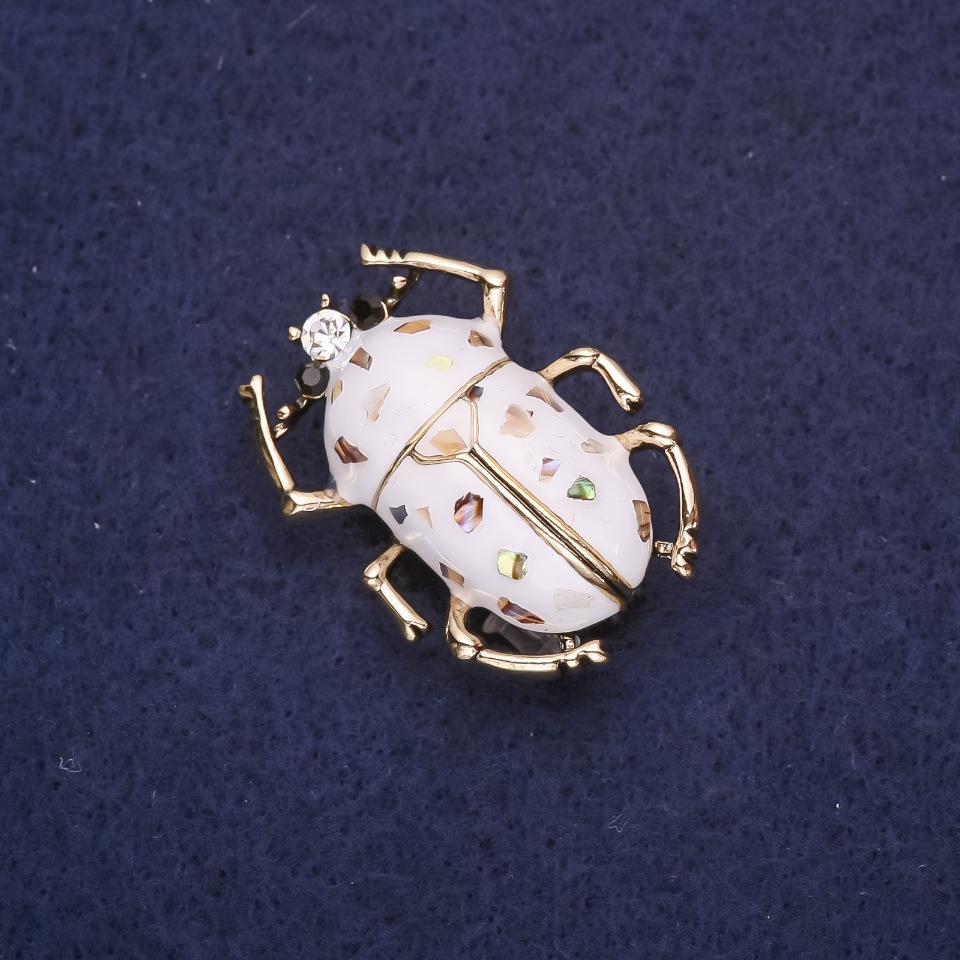 Beetle Brooch with White Enamel and Chalcedony, 33x24 mm, Yellow Metal