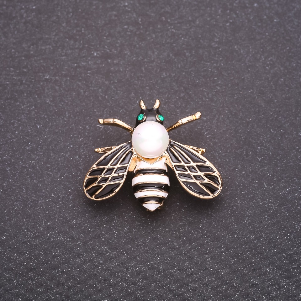 Butterfly Brooch with White and Black Enamel on Yellow Metal