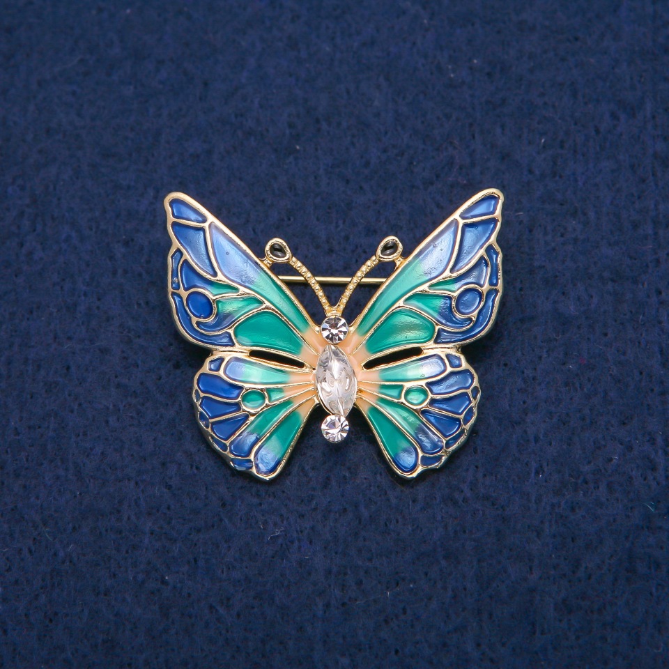 Butterfly Brooch with white crystals and multicolored enamel, gold-tone metal 31x37 mm