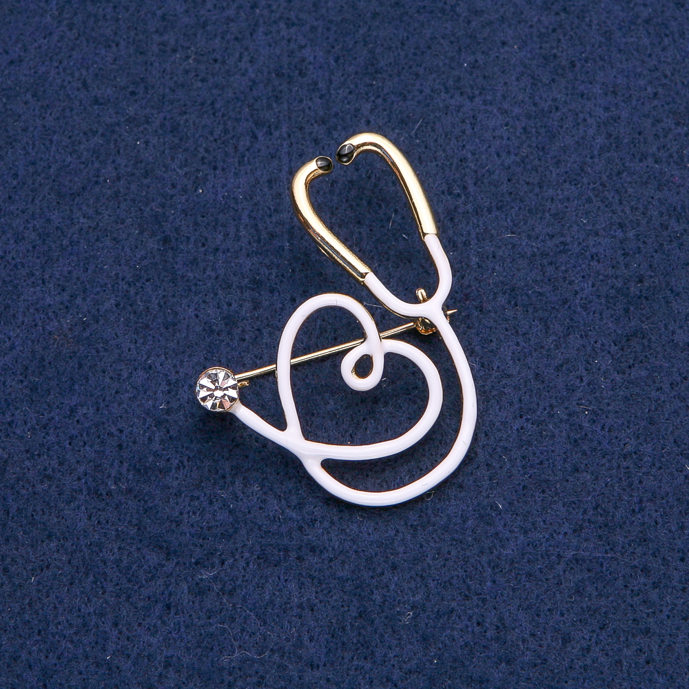 Brooch White Stethoscope with Heart, White Stone, Golden Metal 43x33mm
