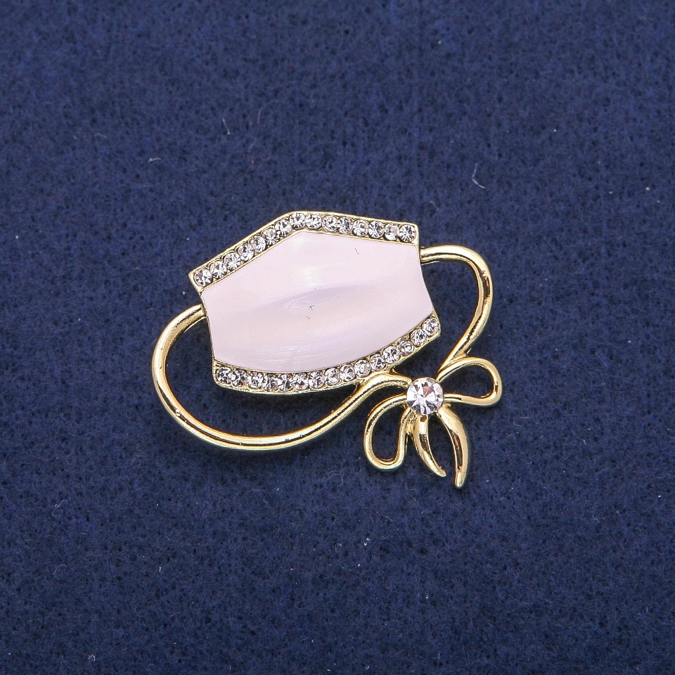 Mask brooch-pendant, white enamel and crystals, golden metal 37×41 mm