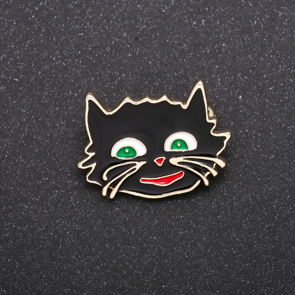 Brooch 'Cheshire Cat' with black enamel and silver-tone metal 27x22mm