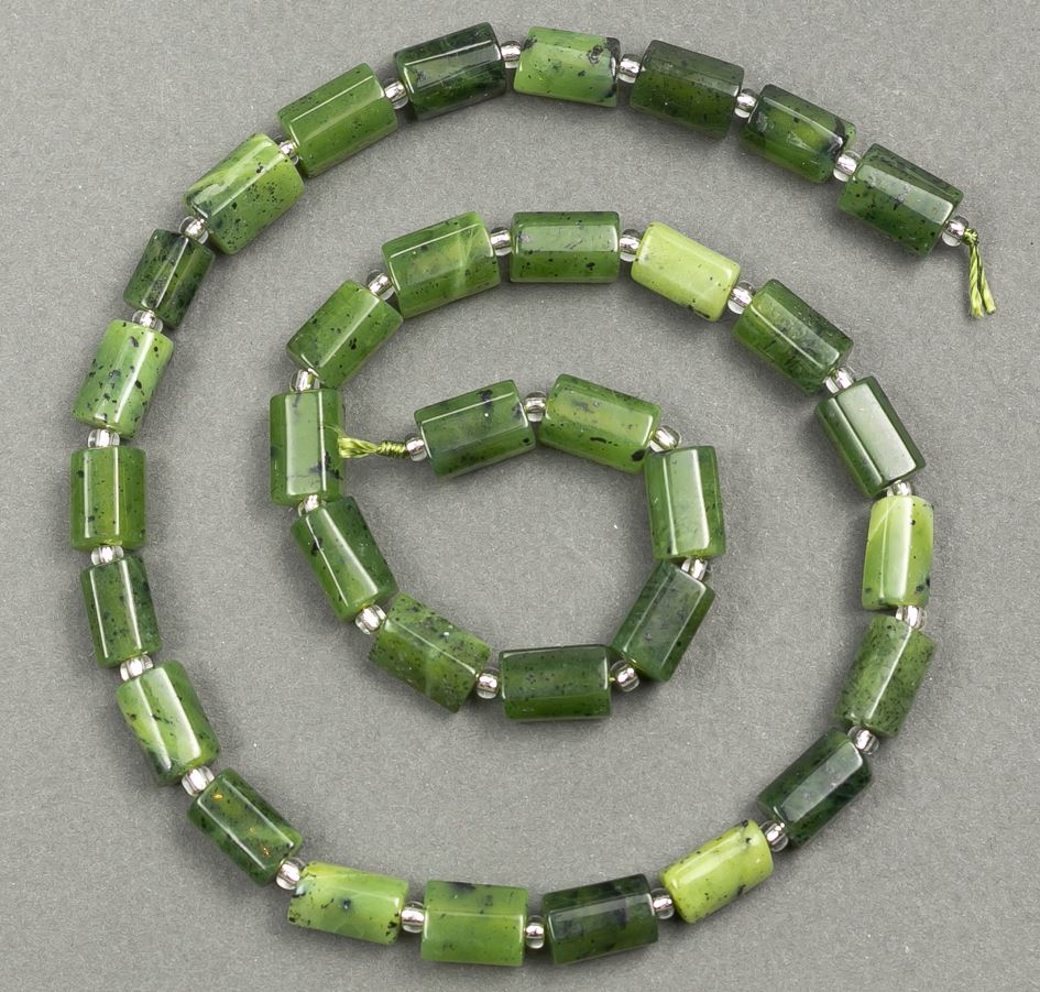 Beads on a thread of natural jadeite, faceted 10x6-7 mm, thread length 40 cm +/- (with 3x2 mm seed beads)