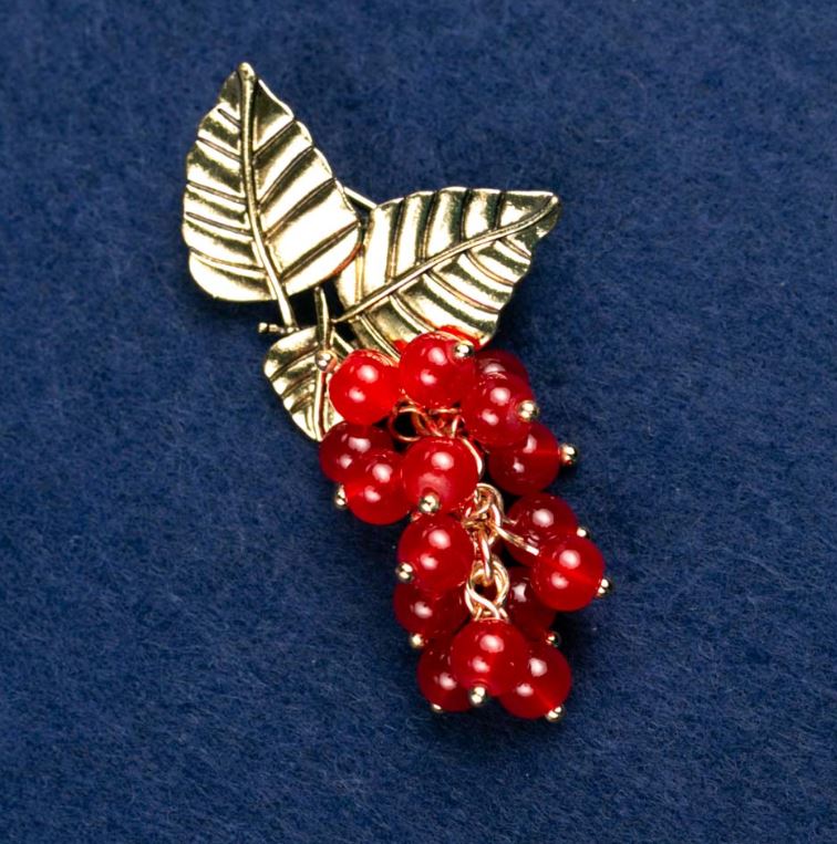 Brooch with natural carnelian 'Branch with berries', gold-tone metal 60x35mm