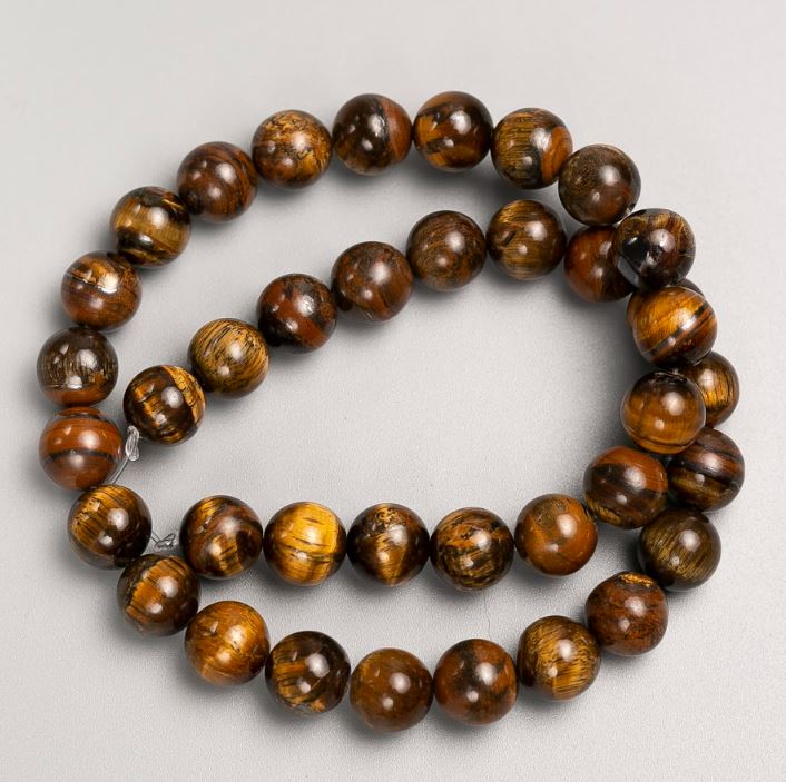 Beads on natural Tiger's Eye thread, diameter 10mm +-, length 38cm +-