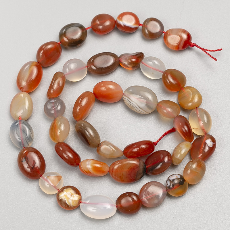Carnelian stone beads, faceted, on thread, 8x12 mm diameter, 40 cm long