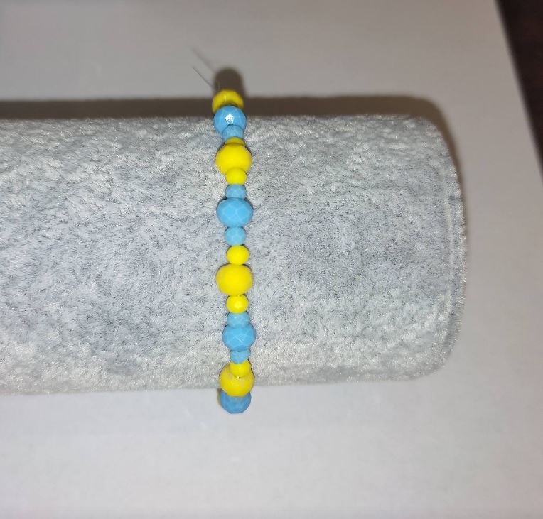 Bracelet 'Ukraine' with Czech crystal 'faceted rondelle' on elastic, diameter 6×4 mm ±, diameter 3×2 mm ±, length 18 cm ±