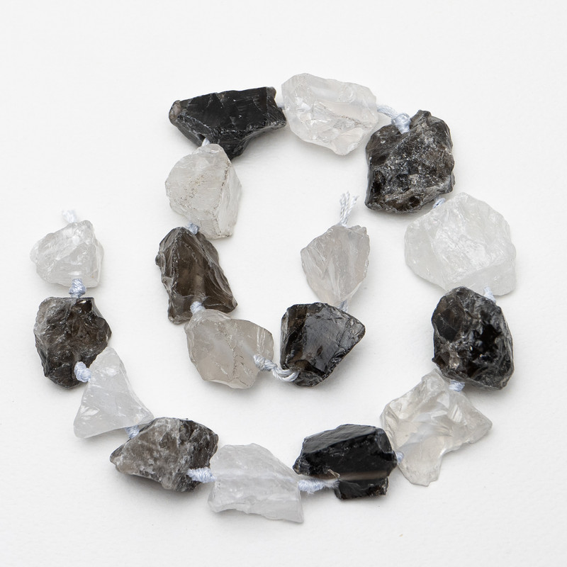 Unpolished beads of Mountain Crystal and Smoky Quartz - Oval, 23x26 mm (±), 42 cm on a thread