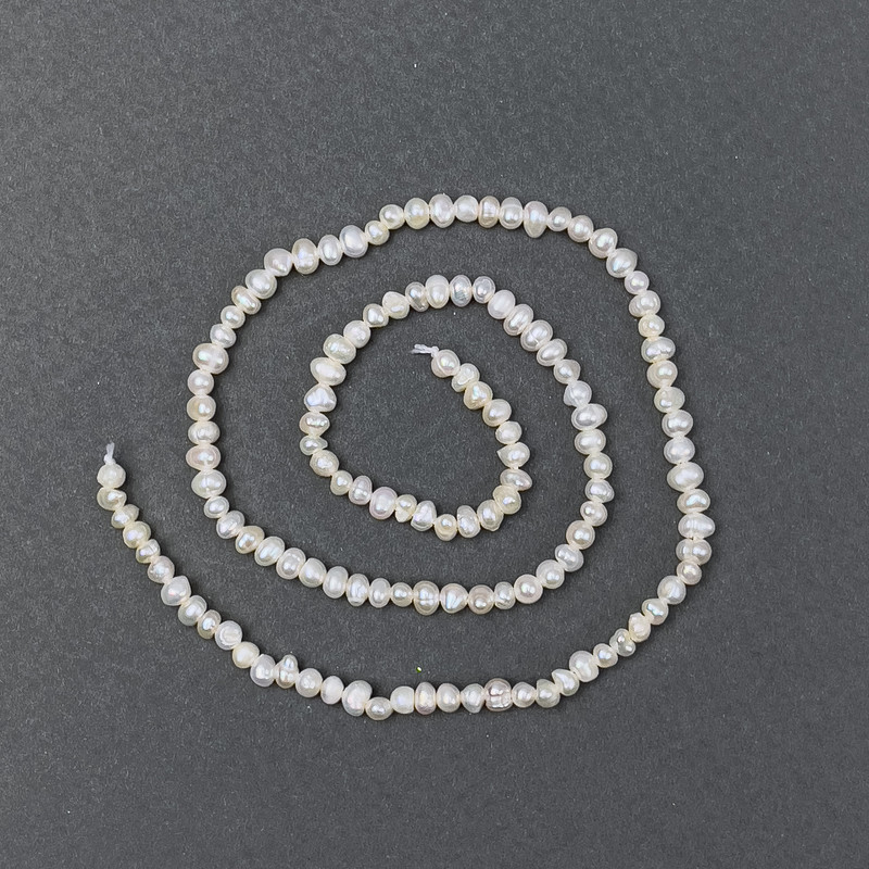 Oval river pearls on a thread, diameter 4x3 mm, length 36 cm ±
