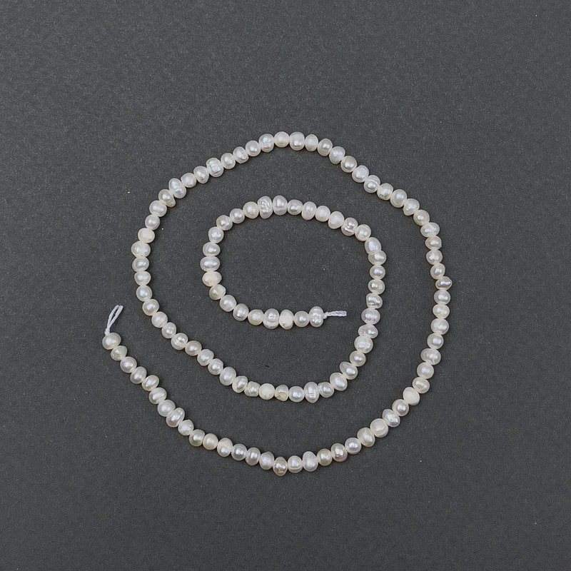 Freshwater oval pearls on a thread, diameter 6x5 mm, length 35 cm