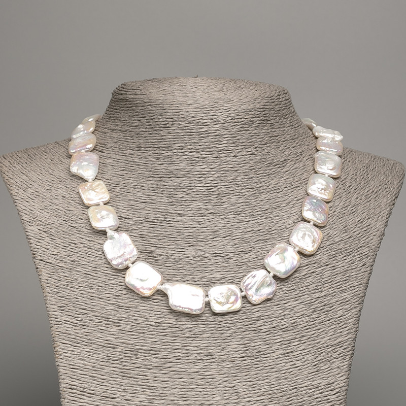 Necklace of natural baroque pearls with a gasoline shade