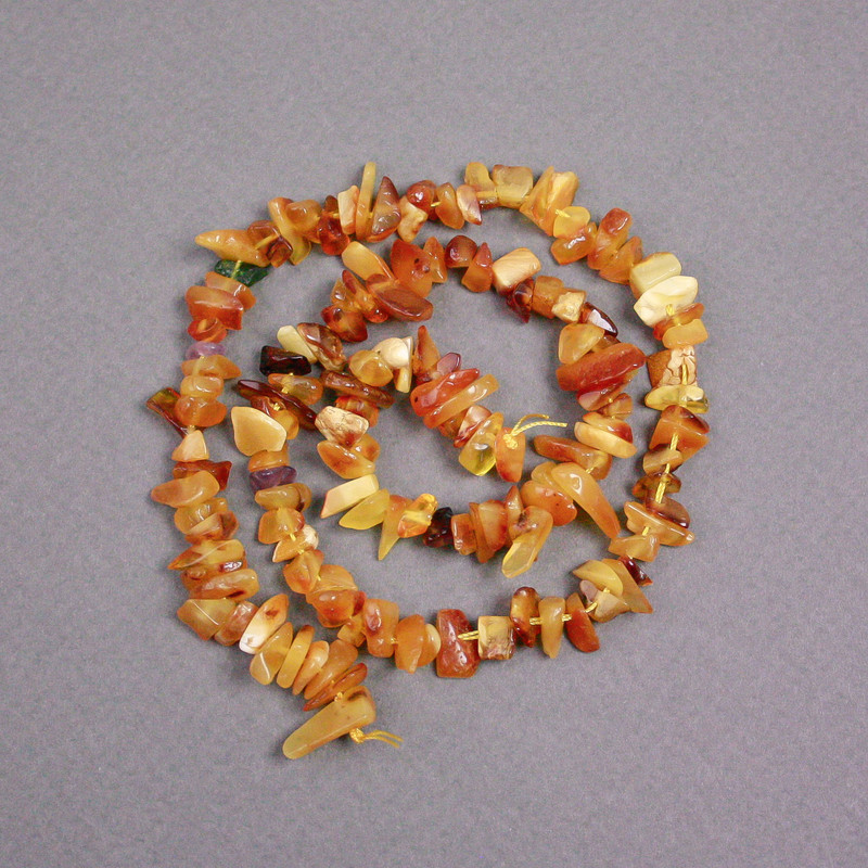 Amber chip beads on a string, diameter 8x3 mm +-, length 39 cm +