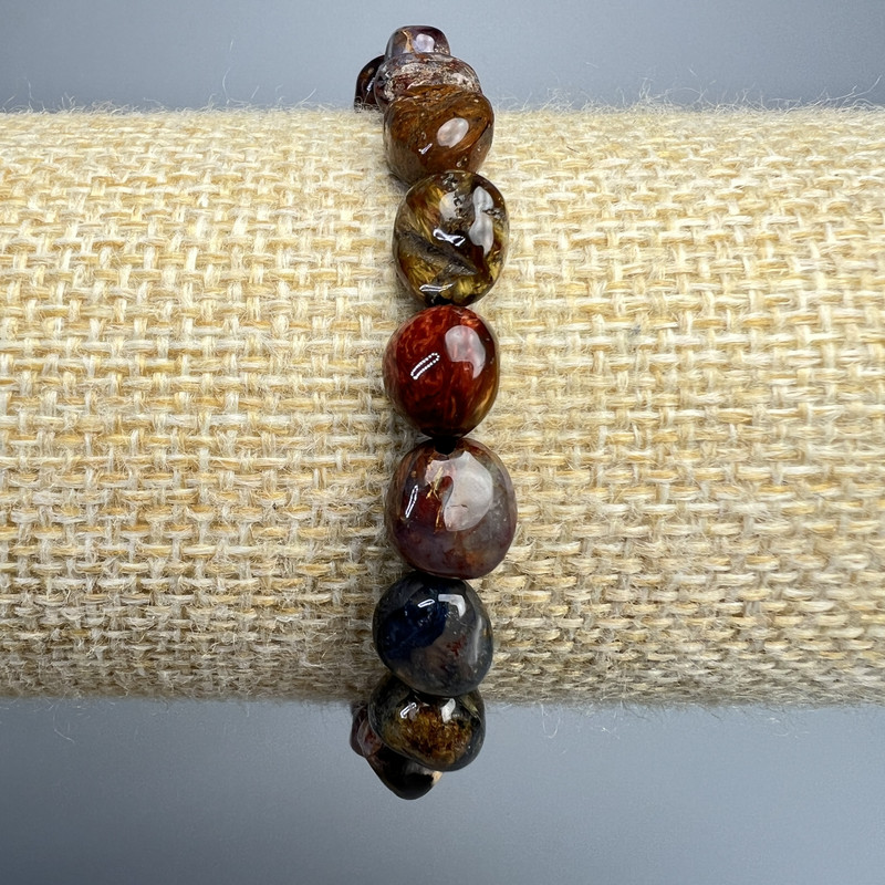 Petersite bracelet, natural, faceted, 8x10 mm diameter, length 18 cm ± (stretch)